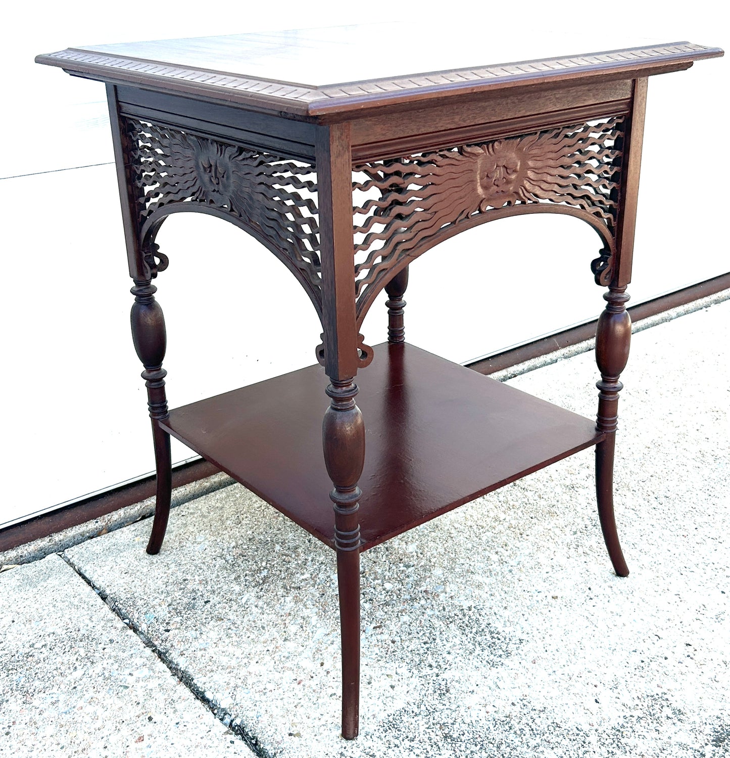 ANTIQUE MAHOGANY STAND WITH UNUSUAL SUN FACES ON SIDES