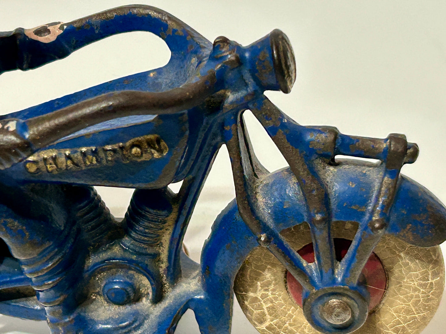 ANTIQUE CAST IRON CHAMPION TOY MOTORCYCLE