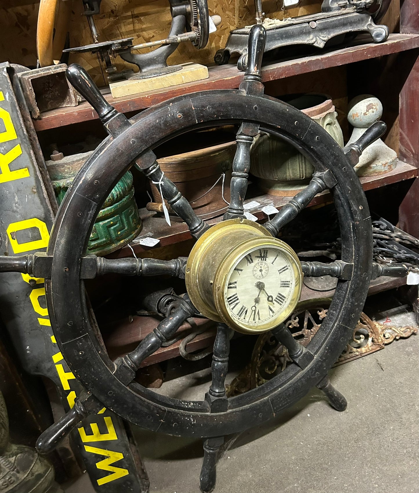 ANTIQUE WOOD SHIP'S WHEEL WITH ANTIQUE BRASS CLOCK IN CENTER