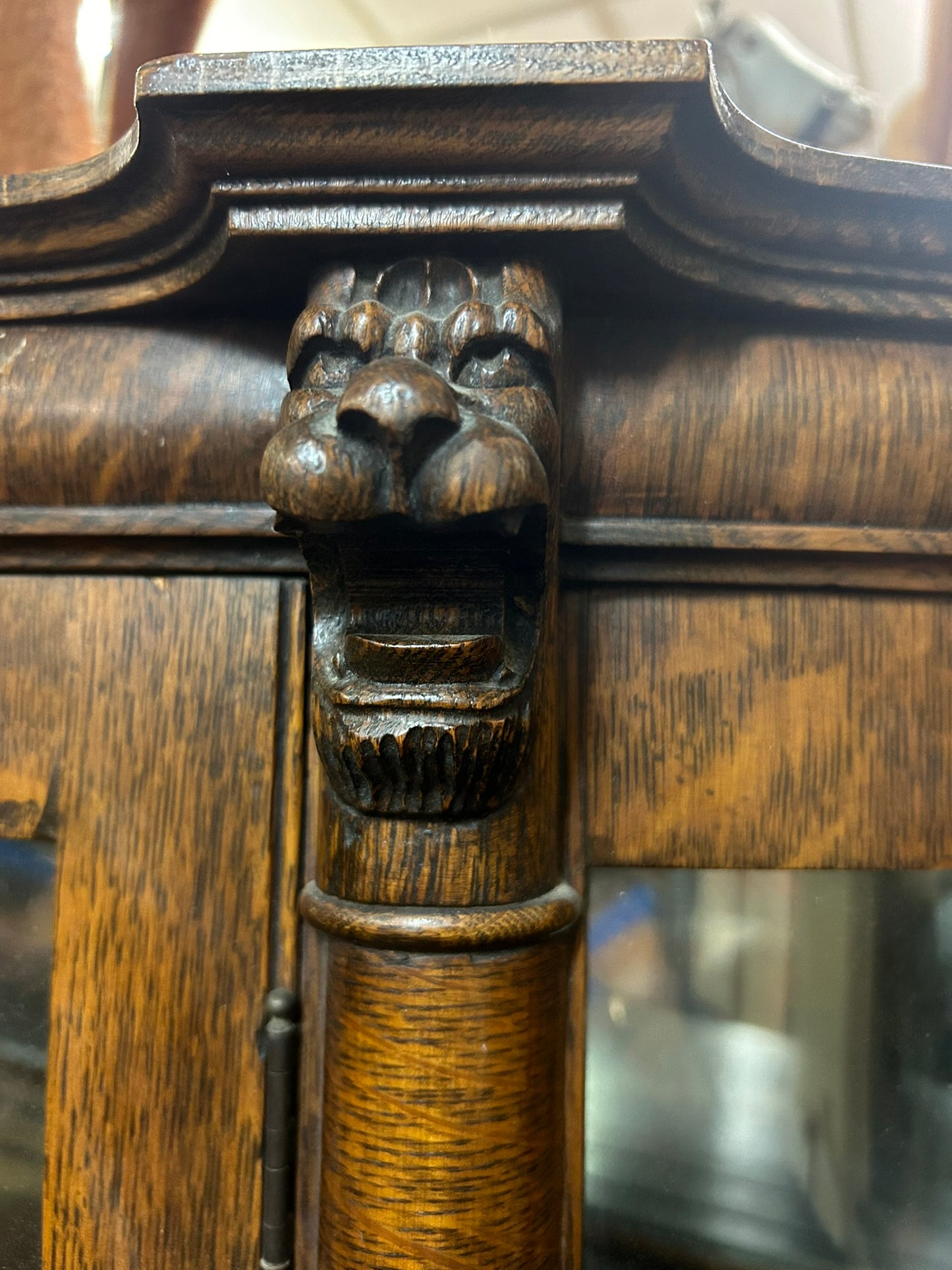 ANTIQUE OAK TRIPLE CURVED GLASS CHINA CABINET WITH CARVED HEADS