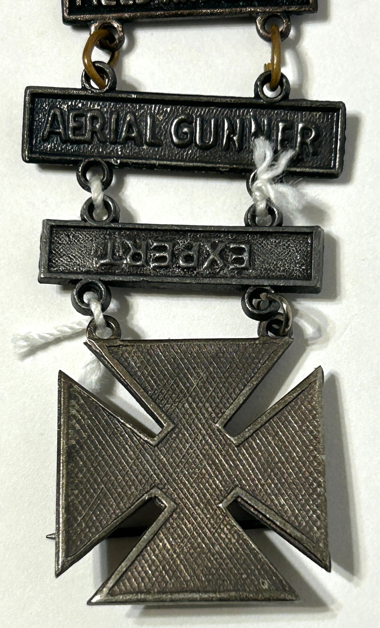 UNITED STATES MILITARY MARKSMAN LADDER BADGE WITH ELEVEN DIFFERENT QUALIFACATIONS