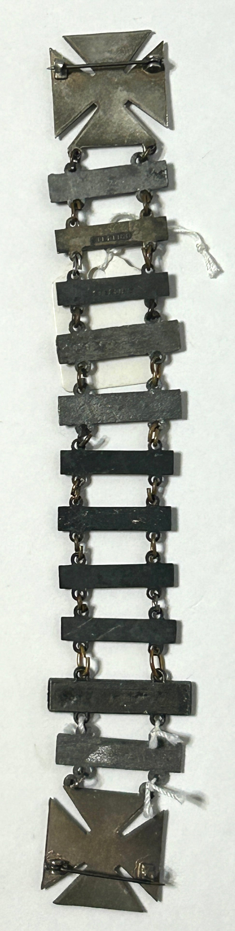 UNITED STATES MILITARY MARKSMAN LADDER BADGE WITH ELEVEN DIFFERENT QUALIFACATIONS