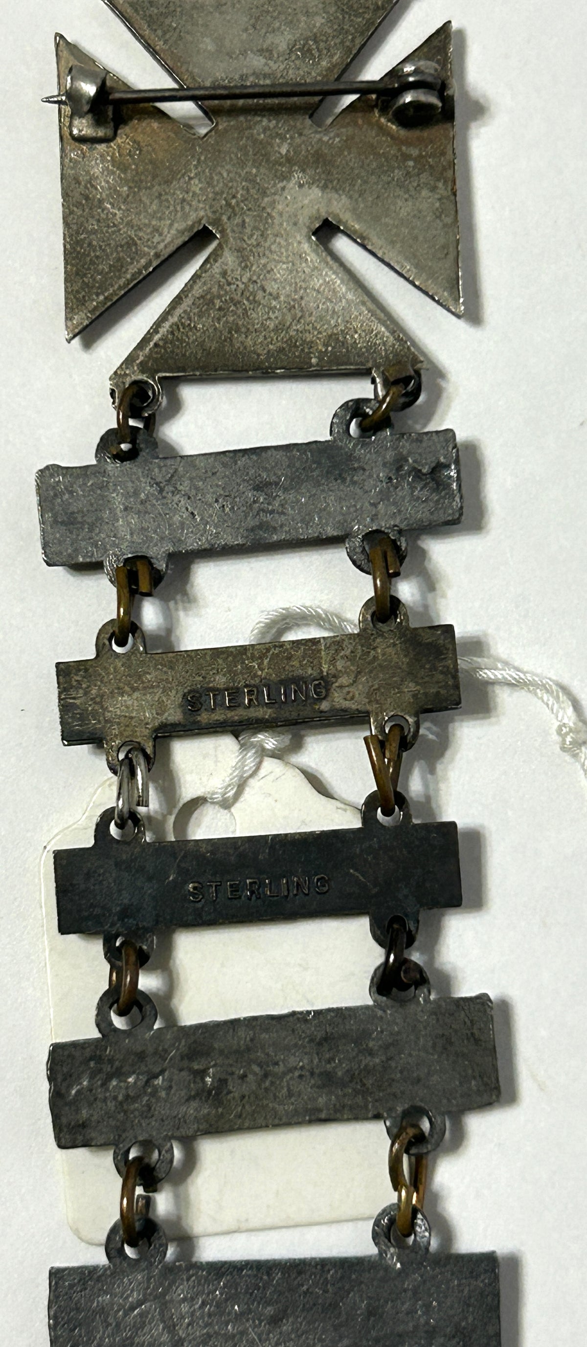 UNITED STATES MILITARY MARKSMAN LADDER BADGE WITH ELEVEN DIFFERENT QUALIFACATIONS