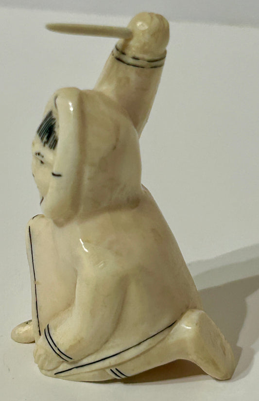 WALRUS IVORY CARVING OF ESKIMO MAN