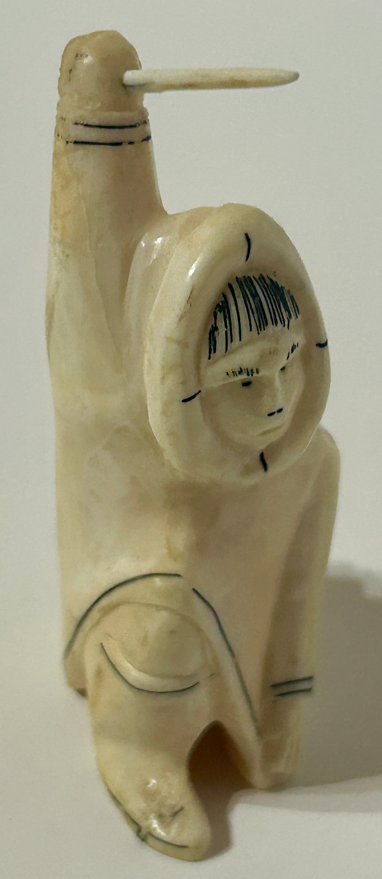 WALRUS IVORY CARVING OF ESKIMO MAN