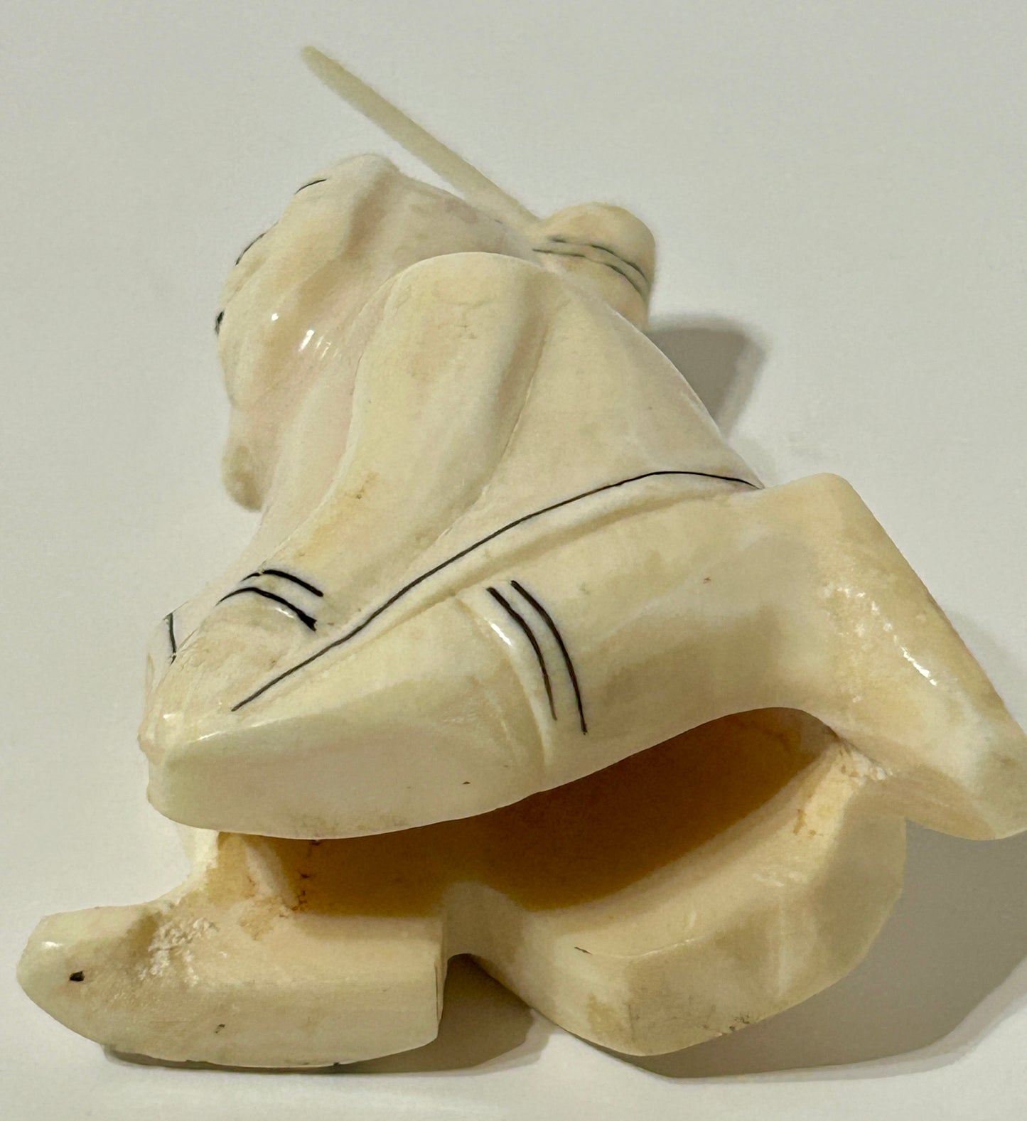 WALRUS IVORY CARVING OF ESKIMO MAN
