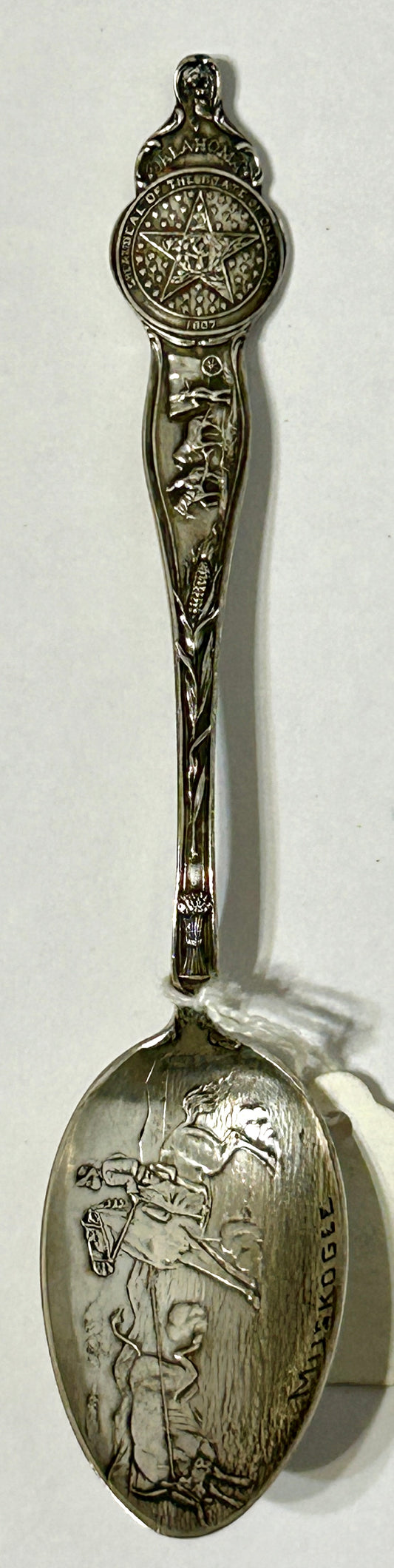 ANTIQUE OKLAHOMA STERLING SILVER SPOON WITH COWBOYS AND OTHER DESIGNS