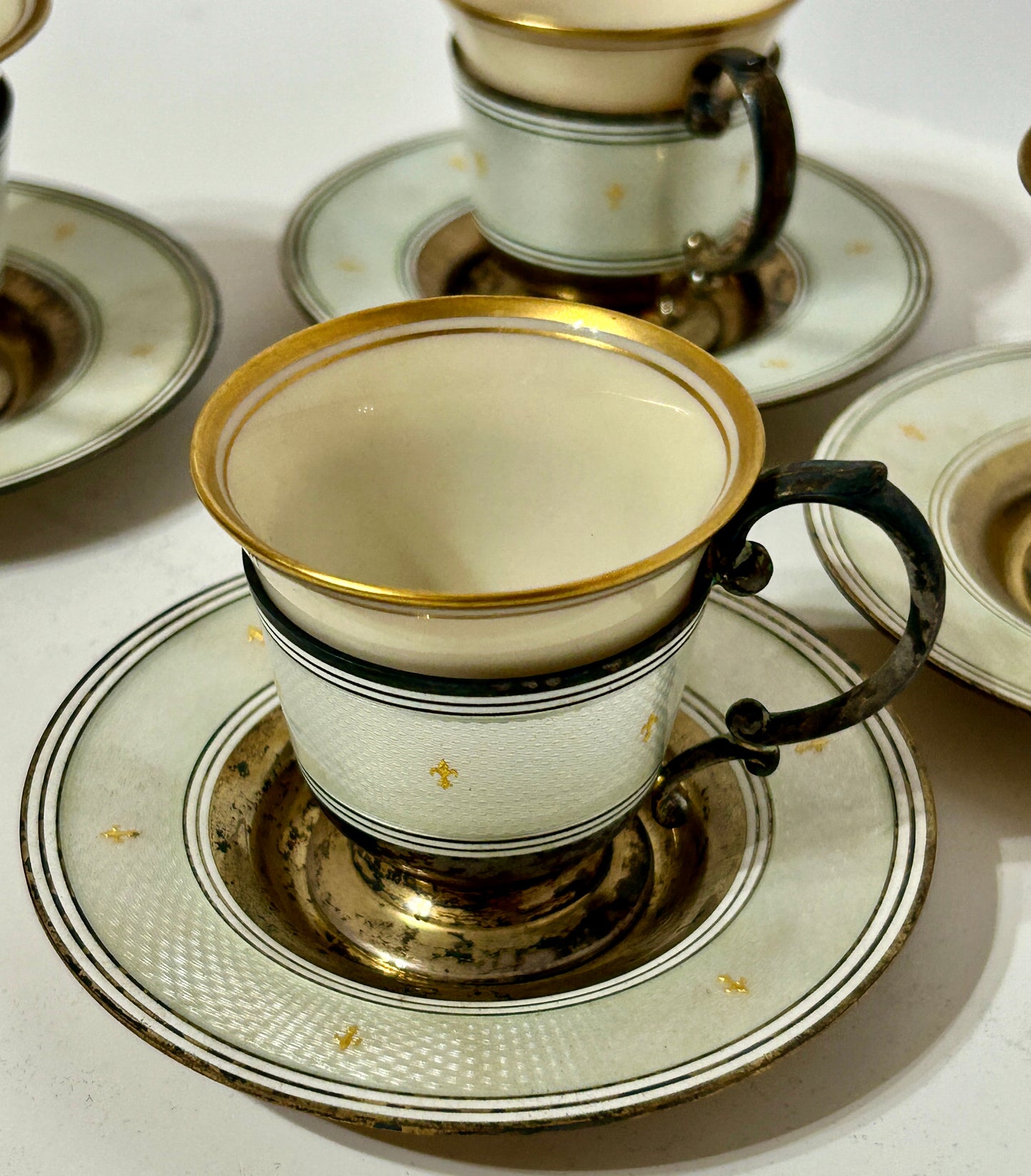 TIFFANY & CO. ENAMEL ON STERLING WITH PORCELAIN DEMITASSE SET