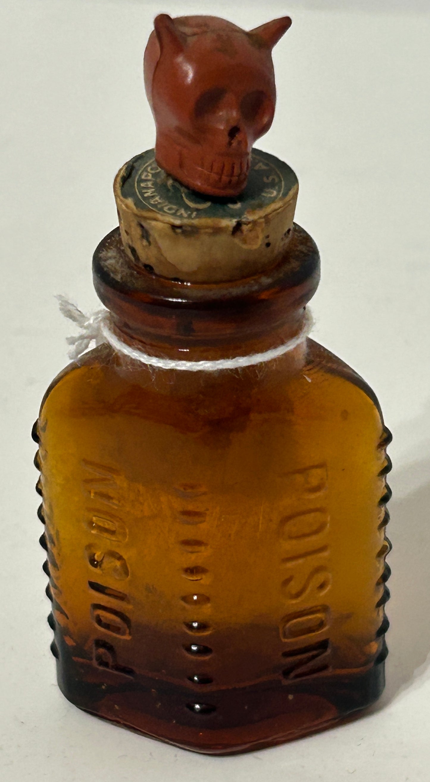 ANTIQUE POISON GLASS BOTTLE AMBER WITH SKULL STOPPER