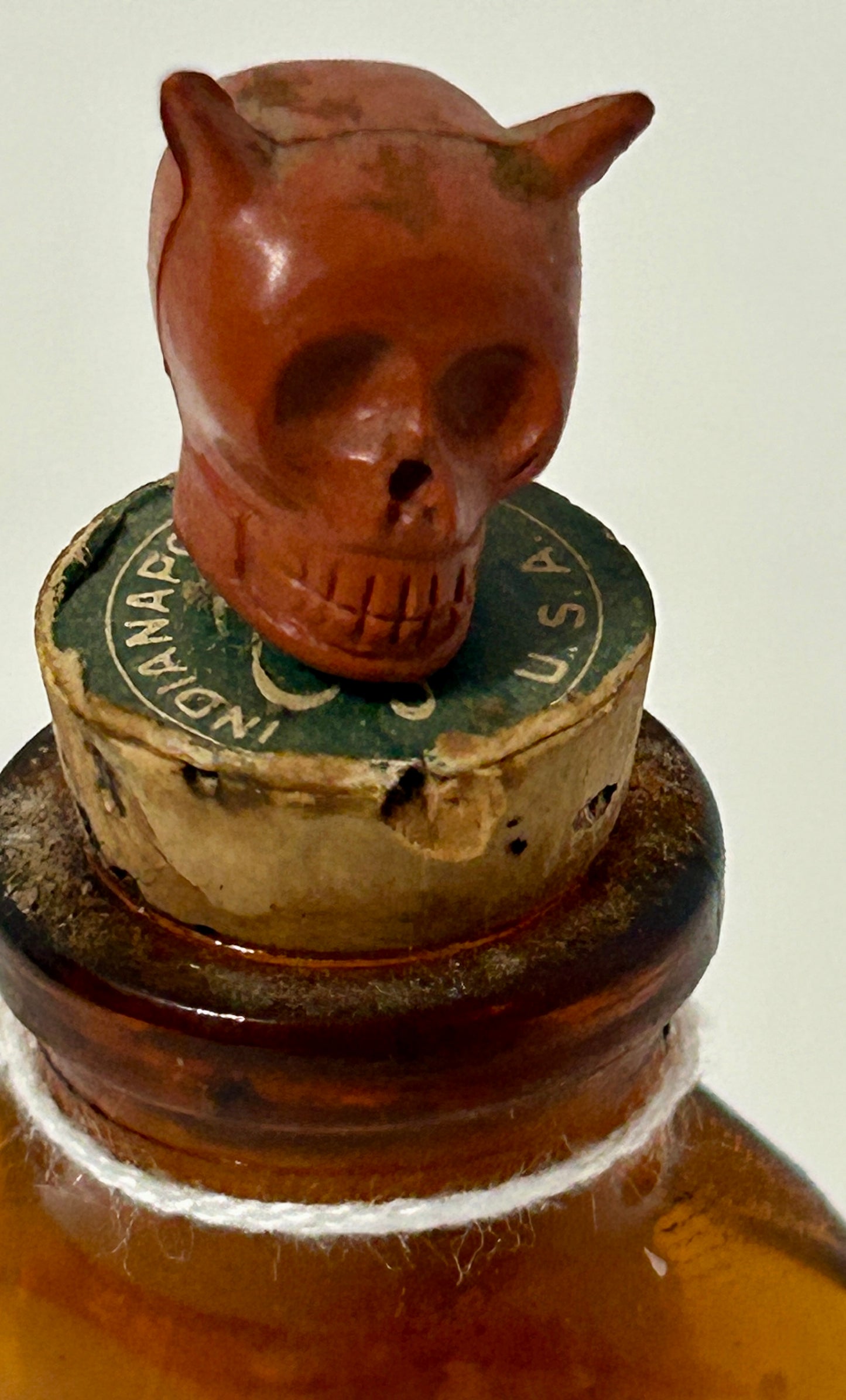 ANTIQUE POISON GLASS BOTTLE AMBER WITH SKULL STOPPER