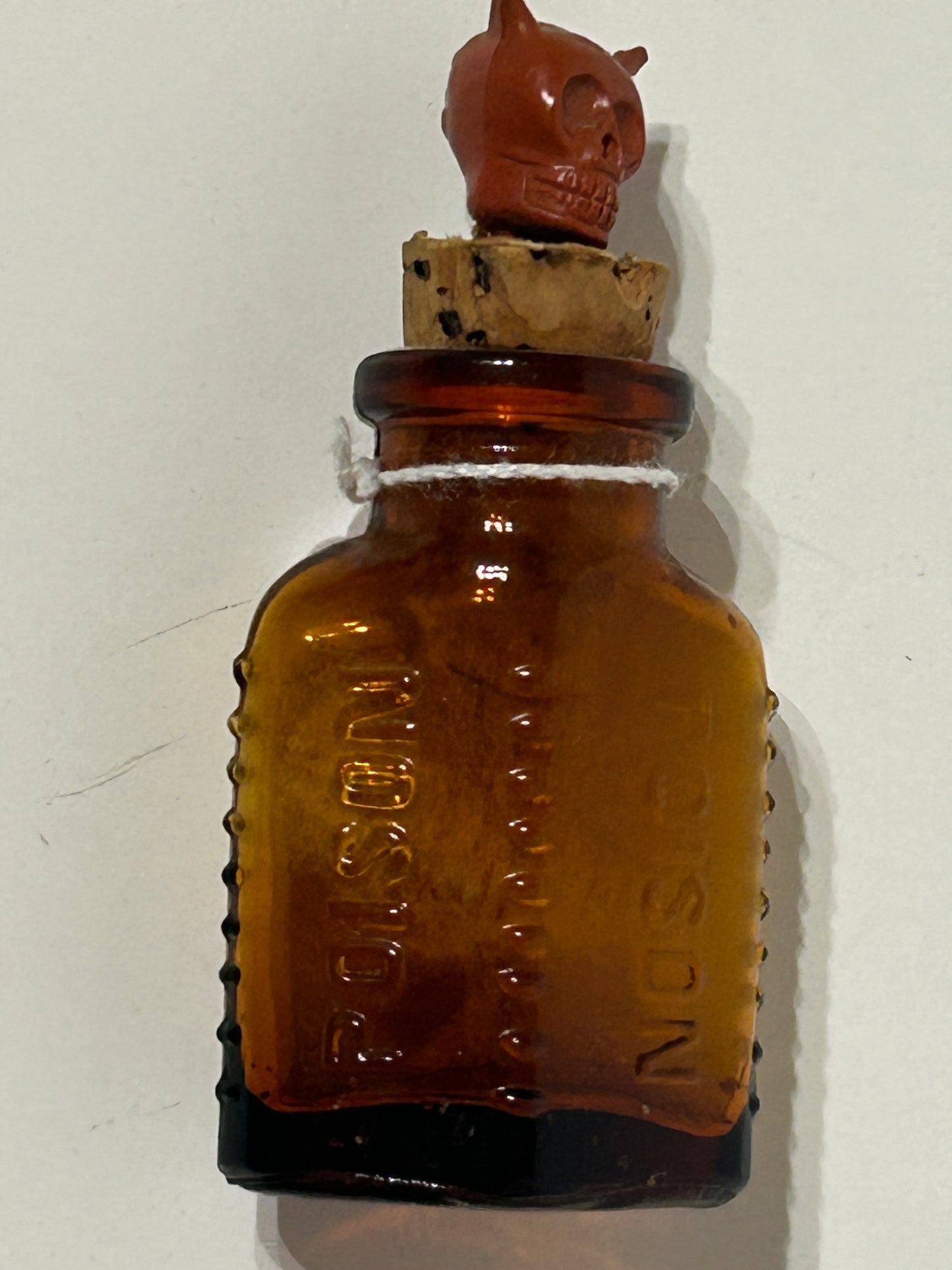 ANTIQUE POISON GLASS BOTTLE AMBER WITH SKULL STOPPER