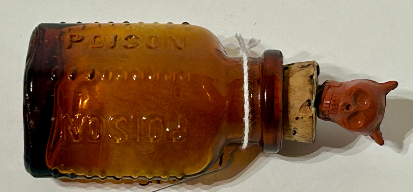 ANTIQUE POISON GLASS BOTTLE AMBER WITH SKULL STOPPER