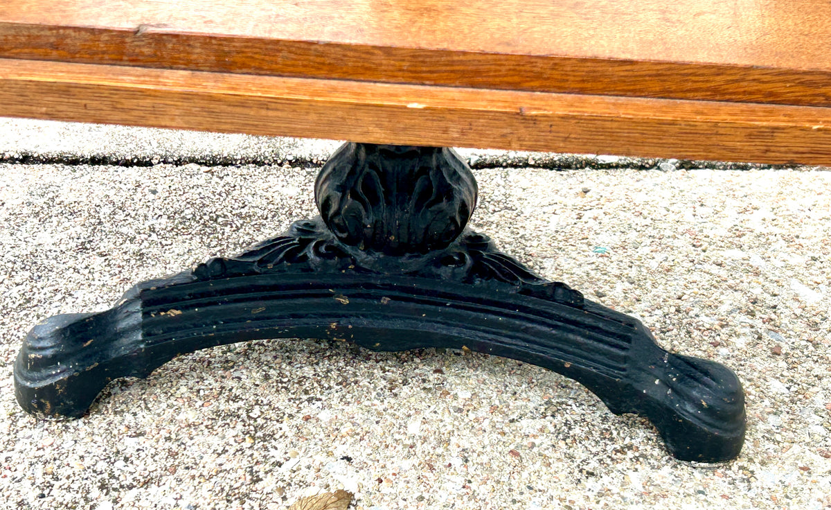 ANTIQUE OAK REVOLVING STANDING BOOKCASE MANFACTURED BY ON ORNATE CAST IRON BASE