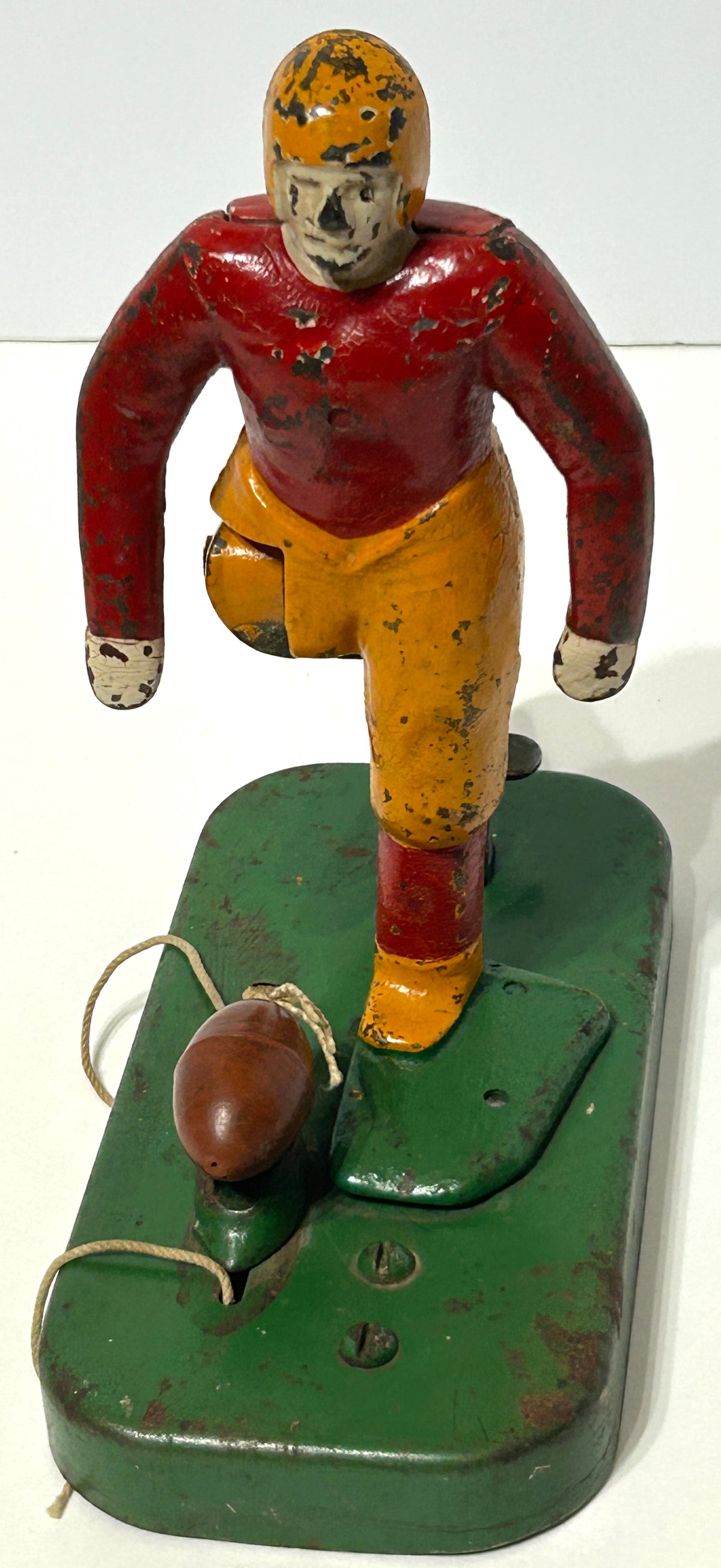 WOOLSEY MECHANICAL FOOTBALL PLAYER KICKING FOOTBALL  IN CAST IRON AND METAL