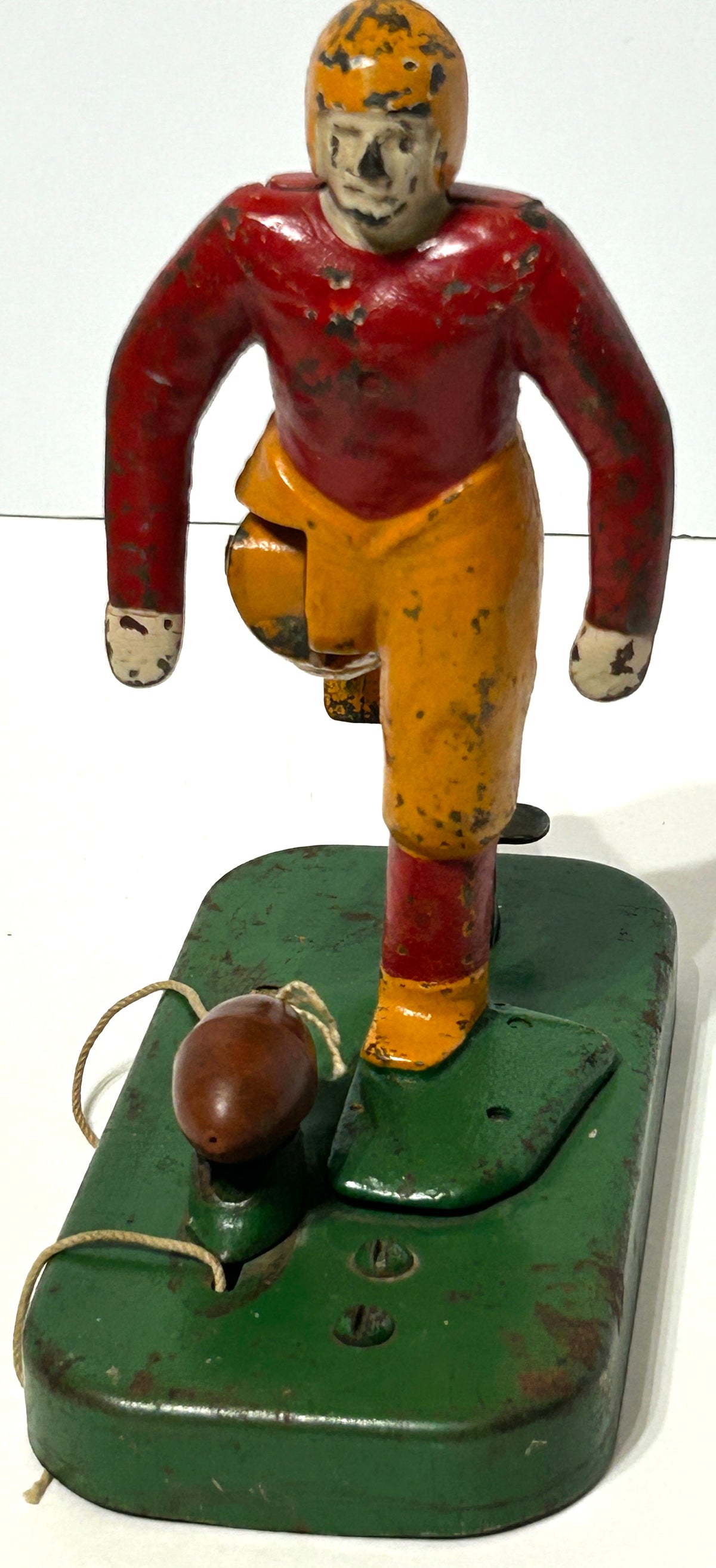 WOOLSEY MECHANICAL FOOTBALL PLAYER KICKING FOOTBALL  IN CAST IRON AND METAL