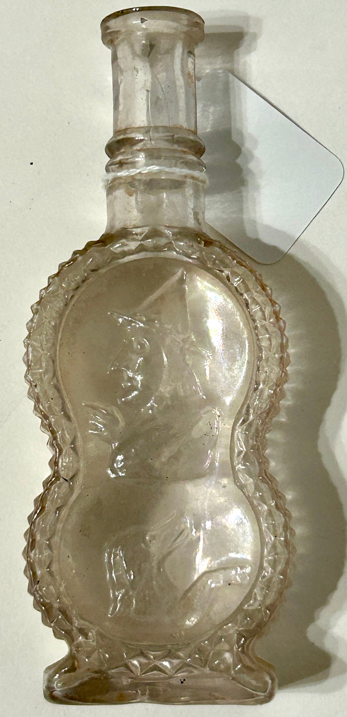 ANTIQUE BOTTLE WITH UNUSUAL EMBOSSED SCENE OF WITCH AND DOG