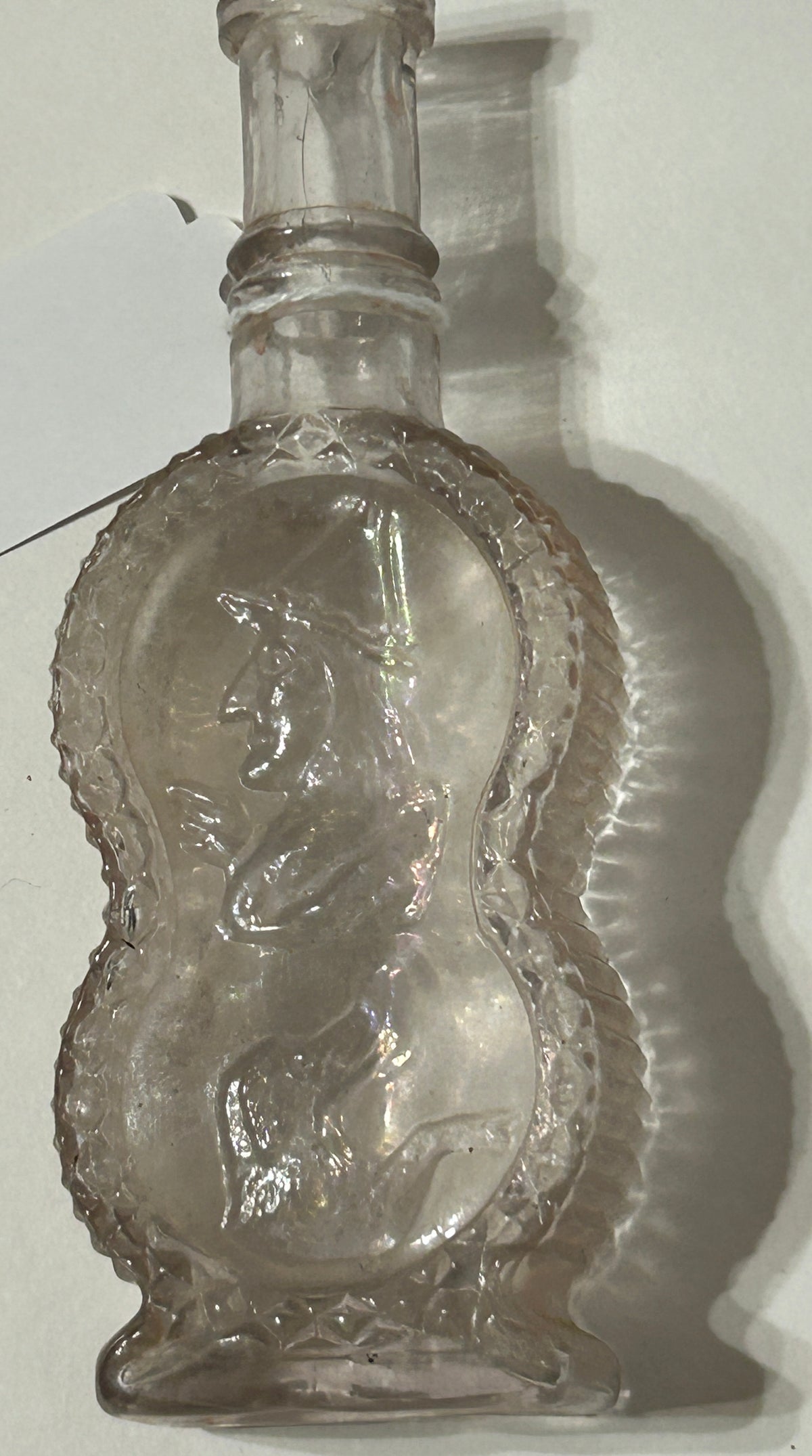 ANTIQUE BOTTLE WITH UNUSUAL EMBOSSED SCENE OF WITCH AND DOG