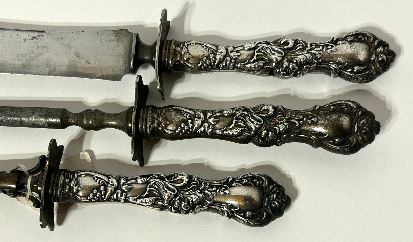 ANTIQUE CARVING SET WITH FANCY SILVER PLATE HANDLES