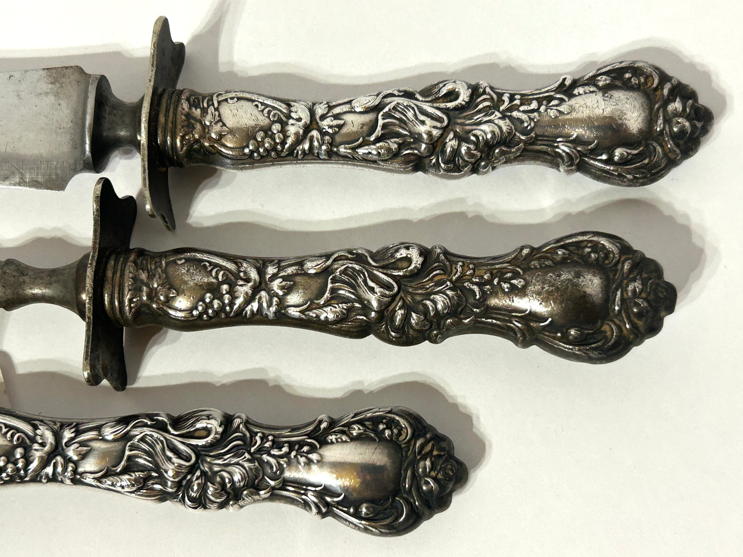 ANTIQUE CARVING SET WITH FANCY SILVER PLATE HANDLES