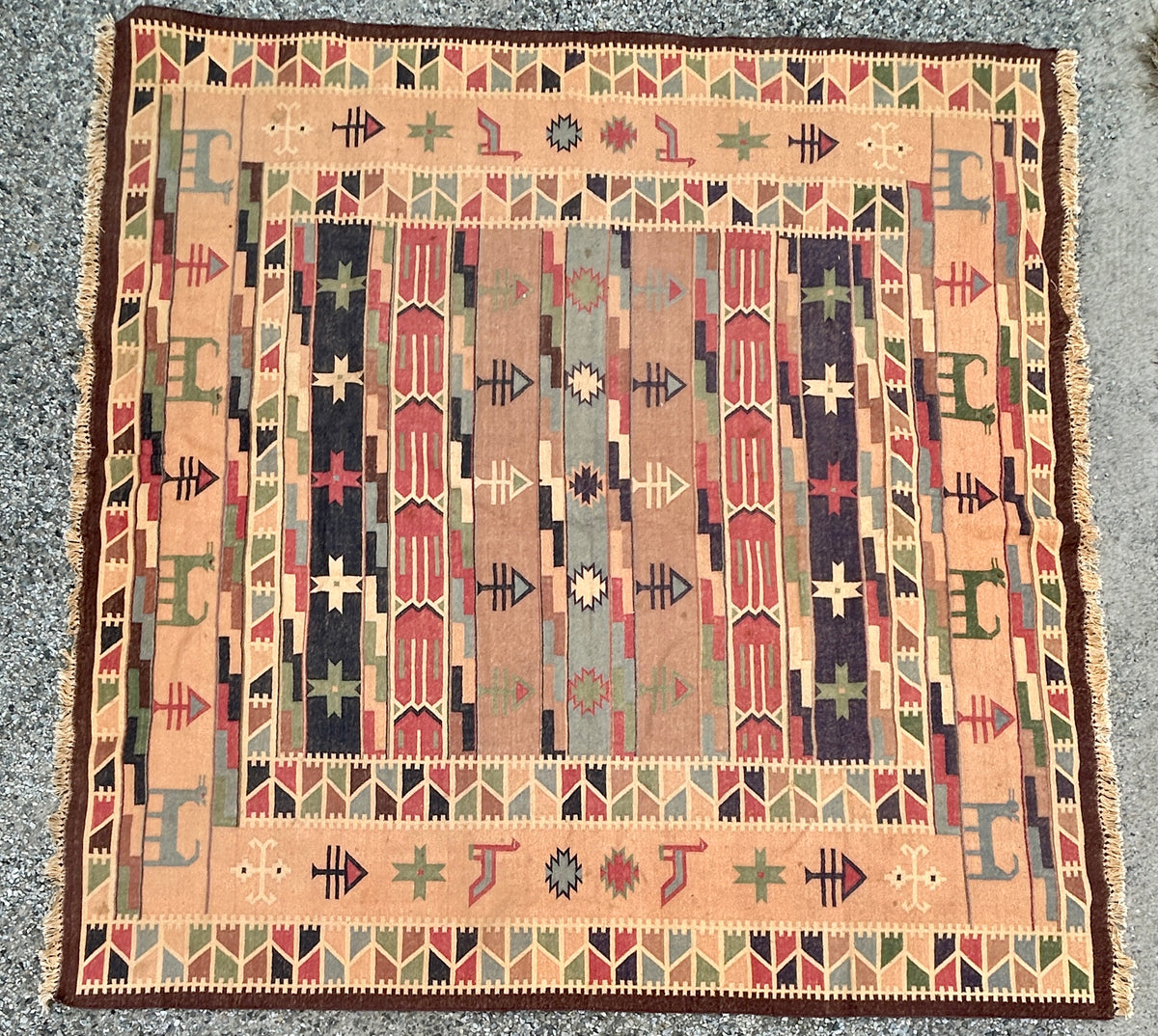 TRIBAL RUG WITH ANIMALS IN DESIGN