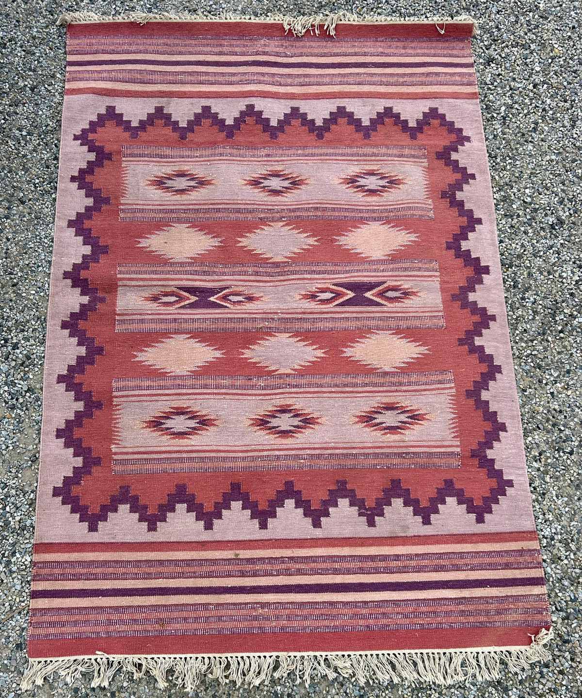 HANDMADE INDIA MAUVE AND PURPLE TRIBAL RUG MARKED WITH FABINDIA LABEL OR REVERSE