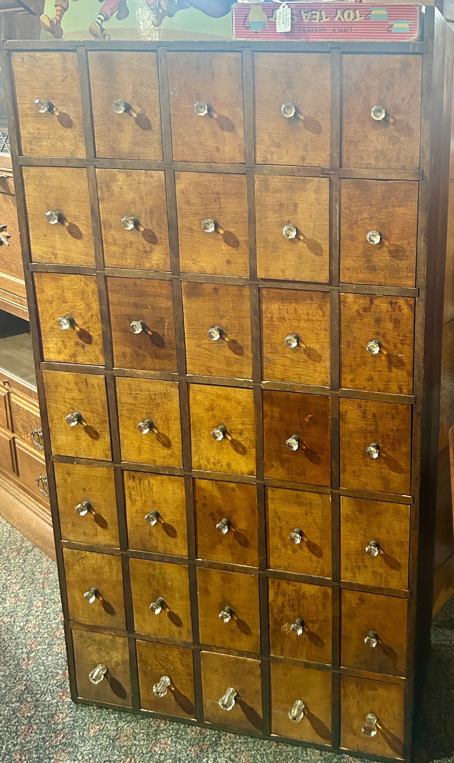 ANTIQUE 35 DRAWER CABINET WITH IUNUSUAL GLASS AND BRASS KNOBS