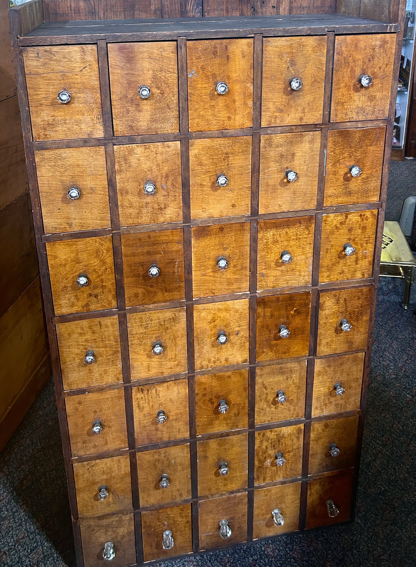 ANTIQUE 35 DRAWER CABINET WITH IUNUSUAL GLASS AND BRASS KNOBS