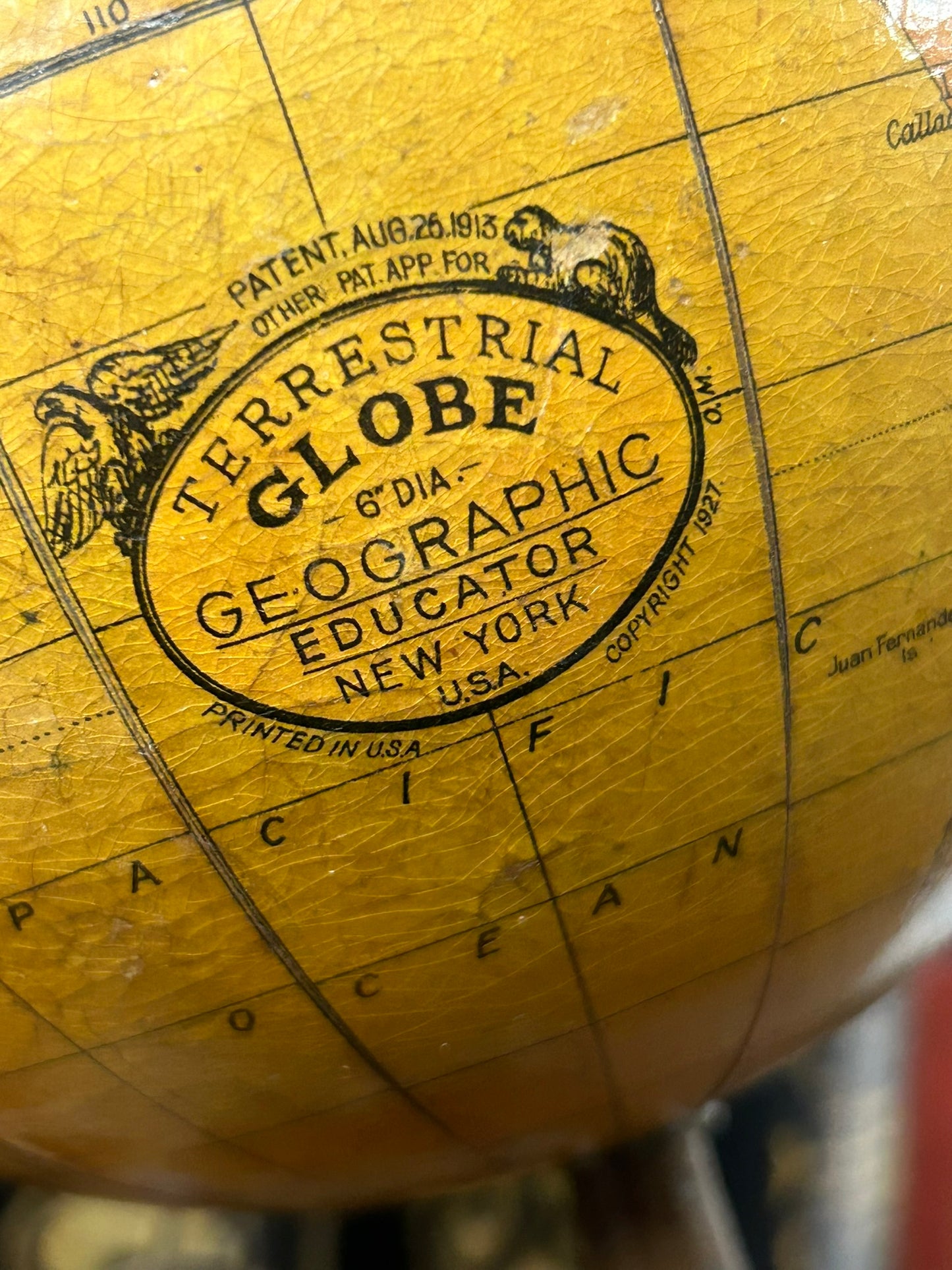 ANTIQUE WORLD GLOBE WITH THREE LEGGED IRON BASE