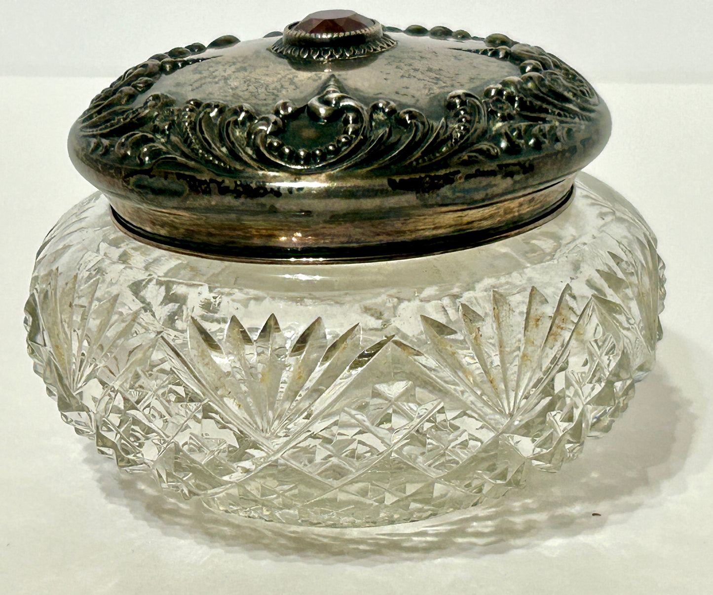 POWDER JAR ANTIQUE WITH STERLING AND AMETHYST COLOR STONE ON CUT GLASS JAR