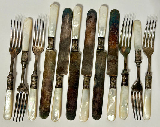 STERLING AND MOTHER OF PEARL HANDLED ANTIQUE SET OF TWELVE FORKS AND KNIVES