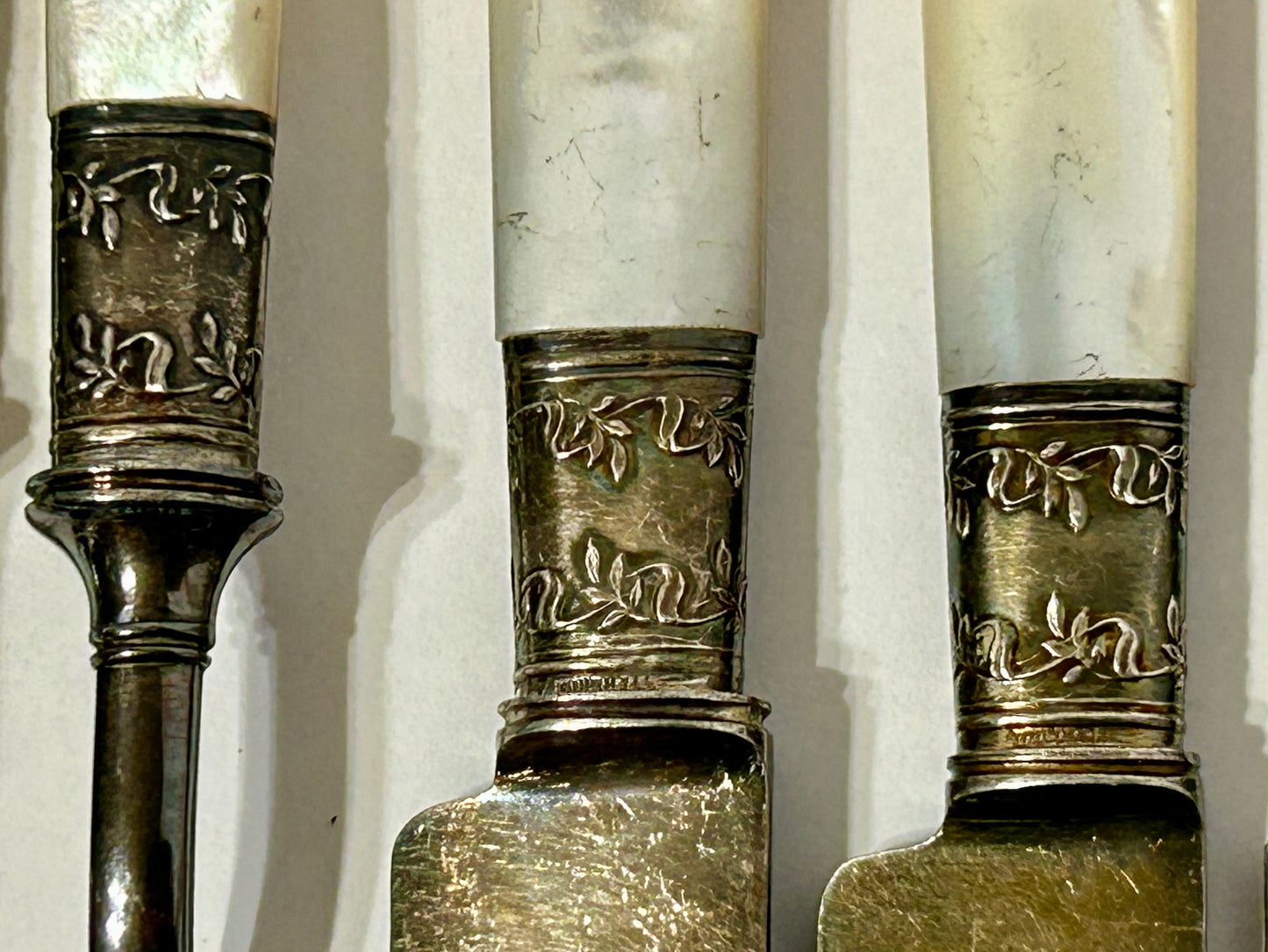 ANTIQUE STERLING AND MOTHER OF PEARL HANDLED KNIVES AND FORKS SET