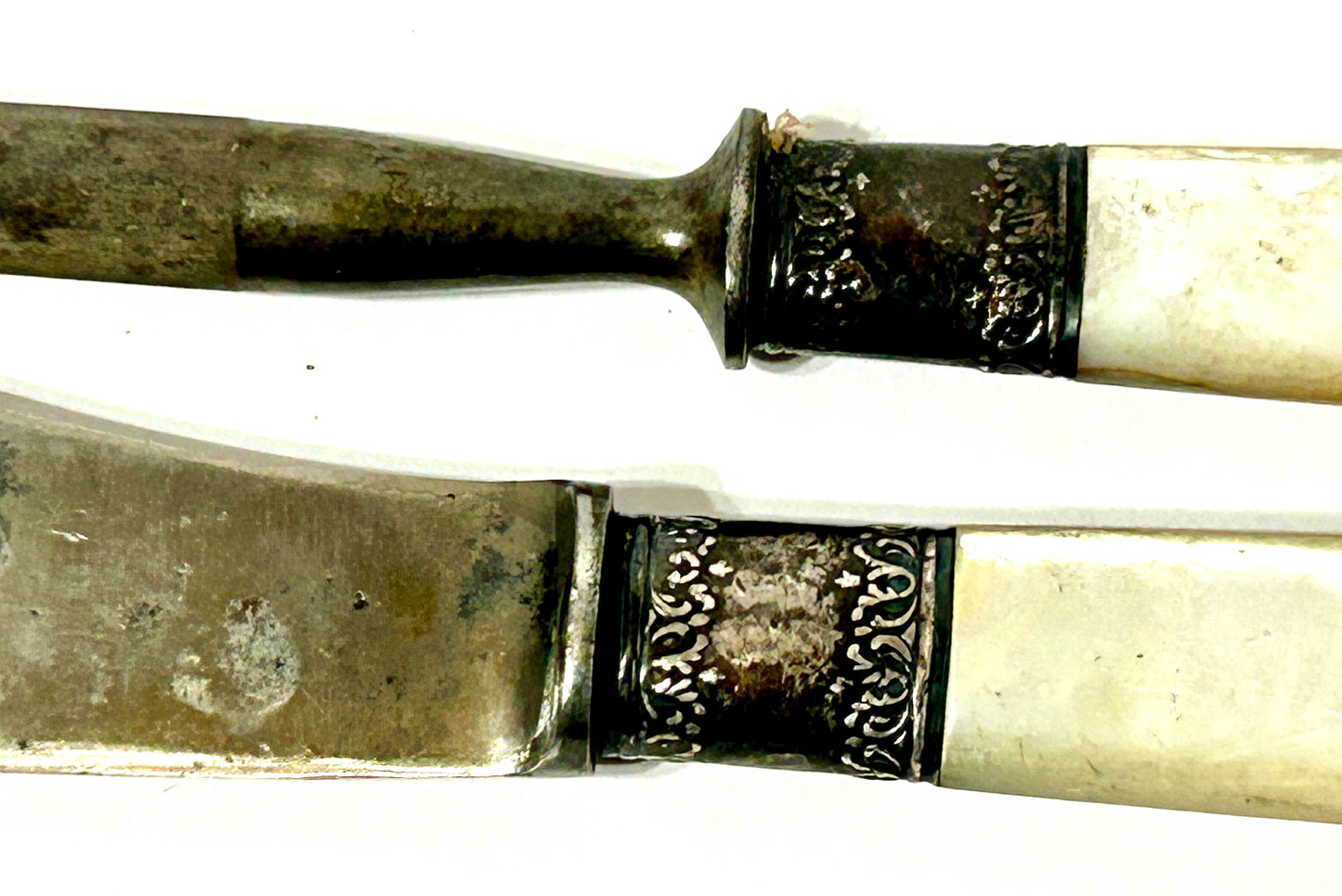 ANTIQUE STERLING AND MOTHER OF PEARL HANDLED KNIFE AND SHARPENER
