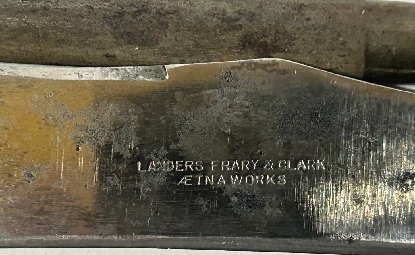 ANTIQUE STERLING AND MOTHER OF PEARL HANDLED KNIFE AND SHARPENER