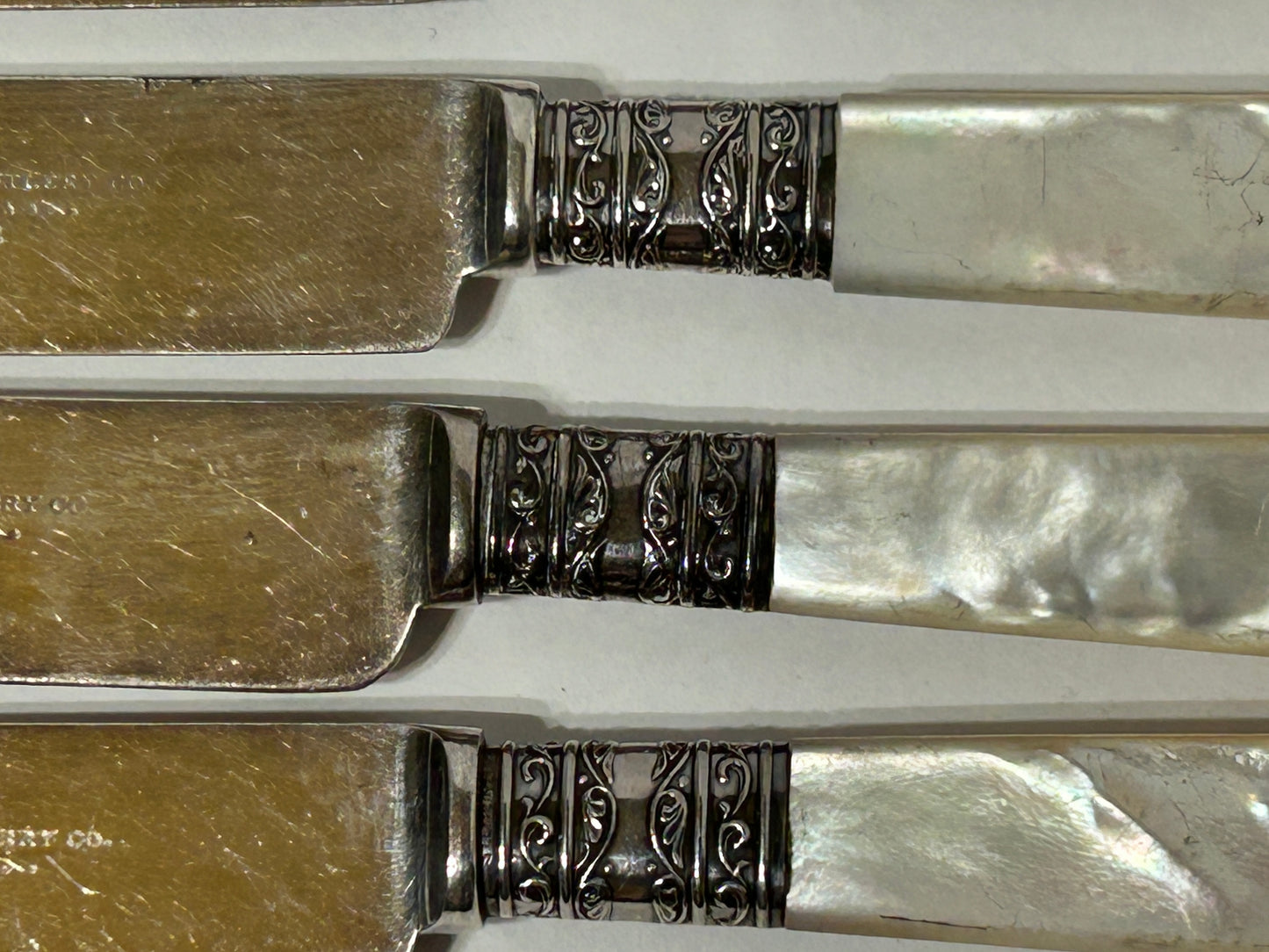 ANTIQUE STERLING AND MOTHER OF PEARL HANDLED SET OF KNIVES