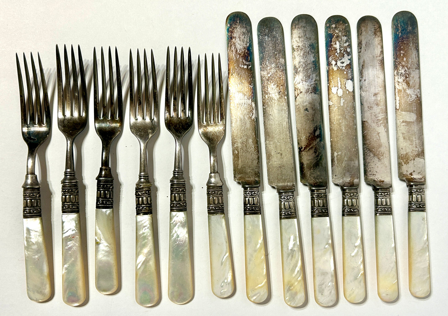 ANTIQUE STERLING AND MOTHER OF PEARL KNIVES AND FORKS